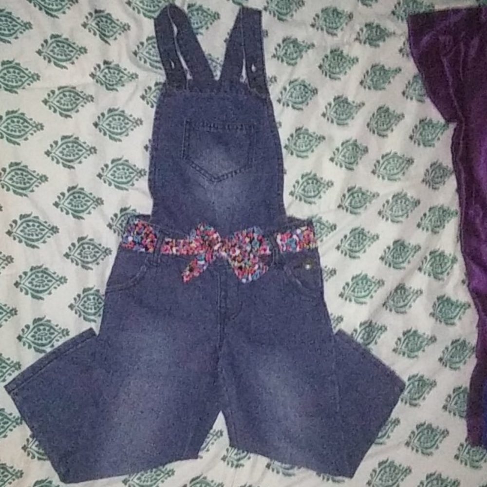 Overalls with a flower belt.
